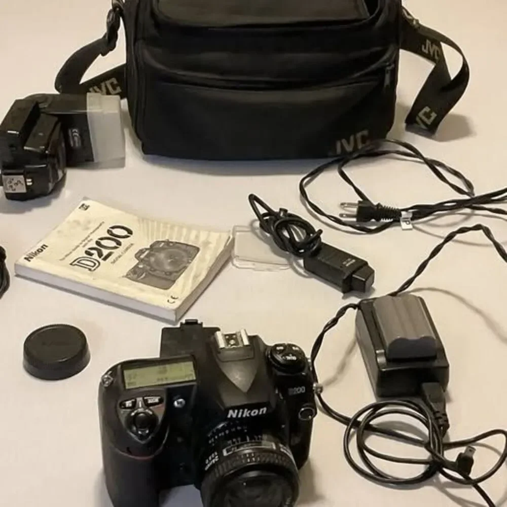 Nikon DS200 24 Mm Lens Plus Trigger 2 Batteries And Accessories
